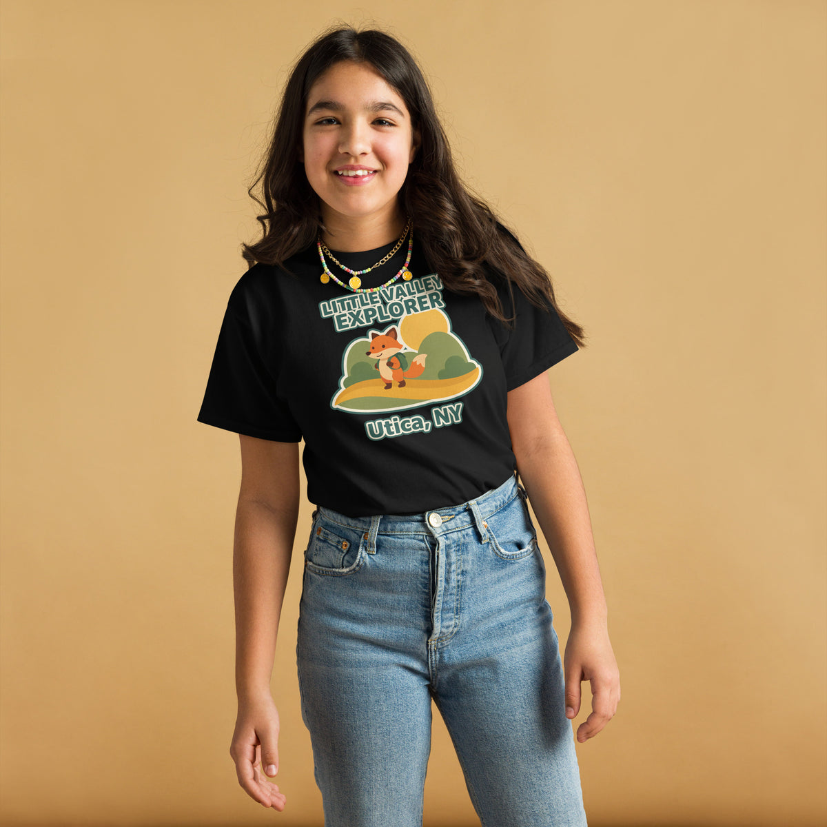 Black youth T-shirt with Little Valley Explorer fox graphic and Utica, NY lettering, front view on a model